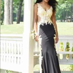 Women’s elegant black & gold dress.